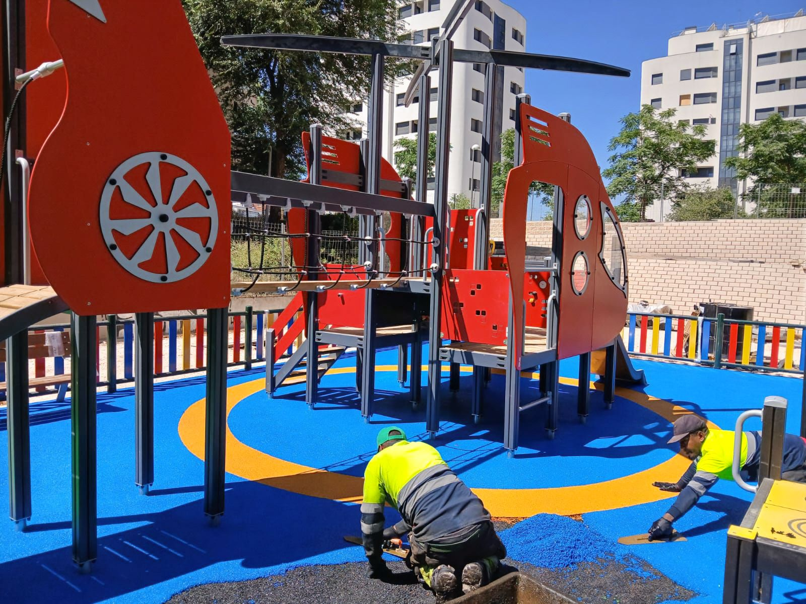 Seamless poured-in-place rubber flooring for playgrounds
